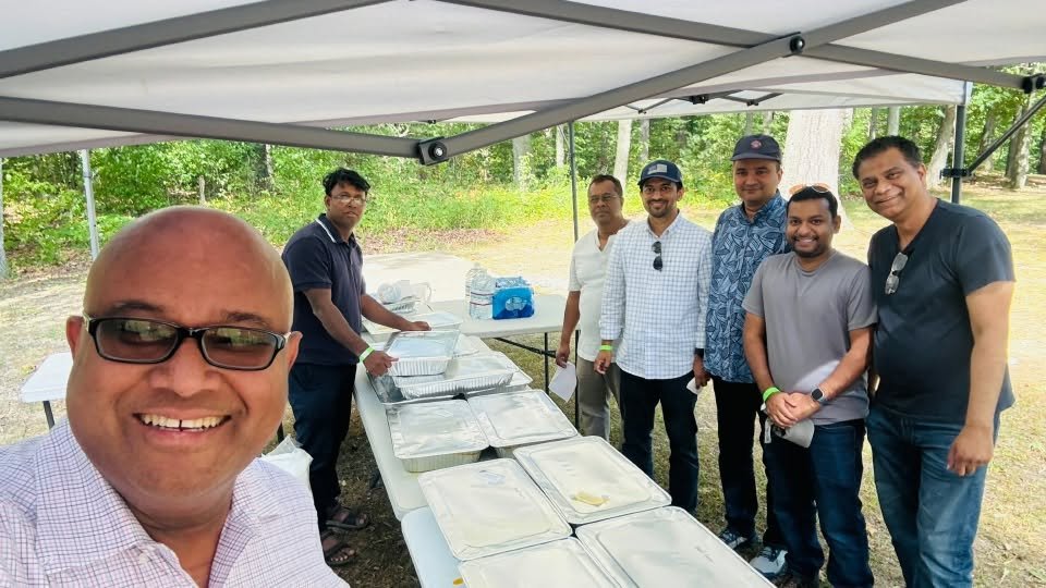 Volunteers behind the serving table at the catering tent.