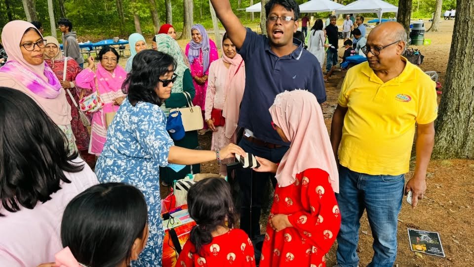 Organisers handing out prizes to the crowd.